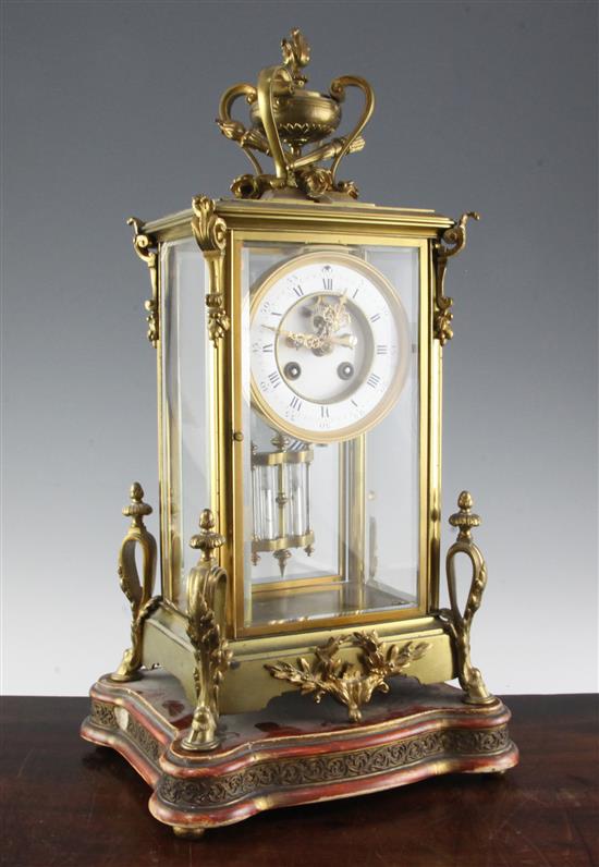 An early 20th century ormolu four glass mantel clock, 17in.